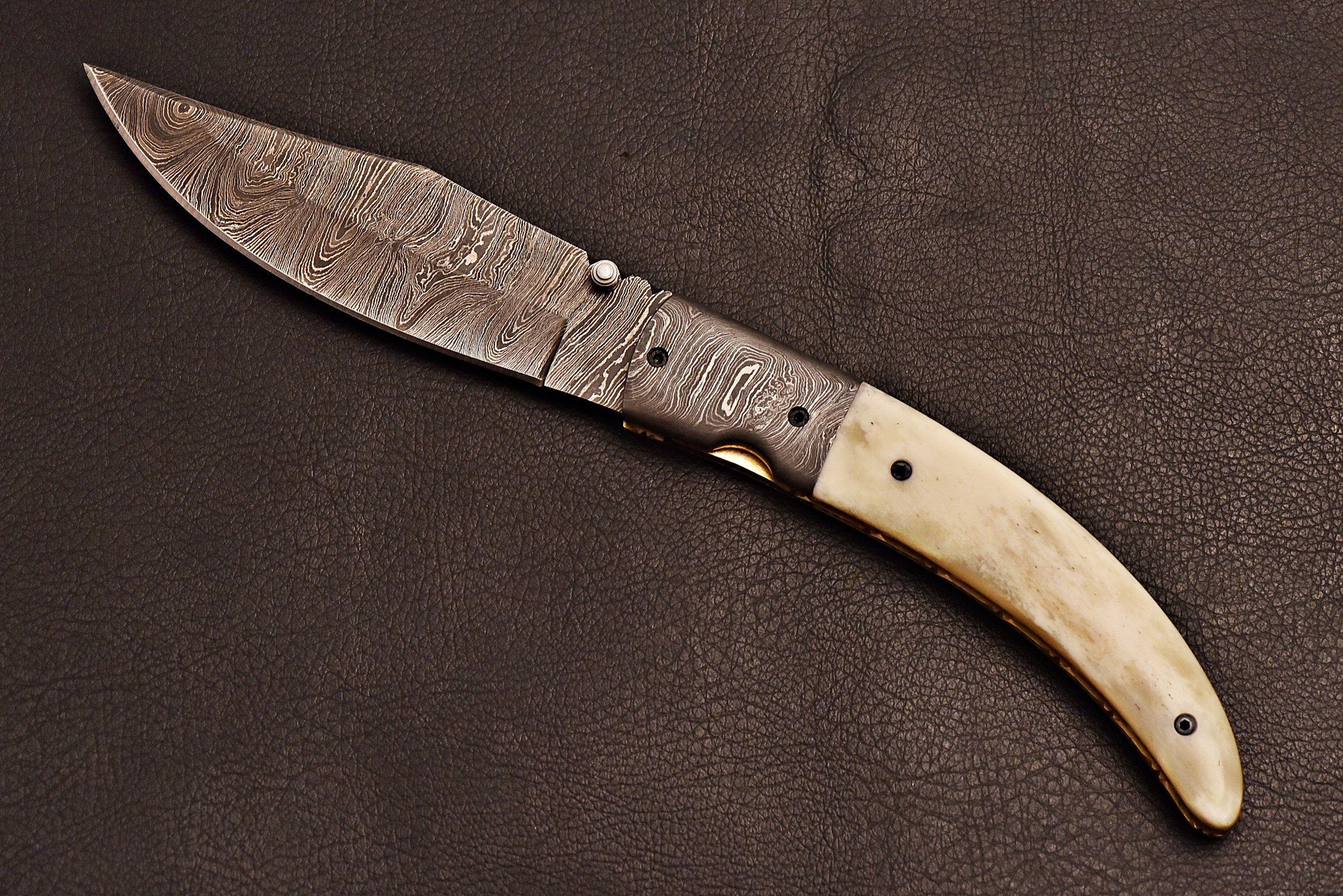 Handmade Damascus steel pocket knife with leather sheath