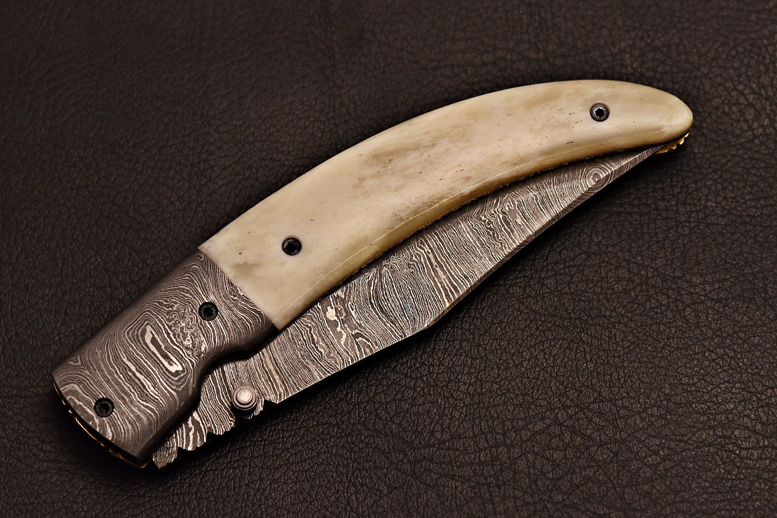 Handmade Damascus steel pocket knife with leather sheath