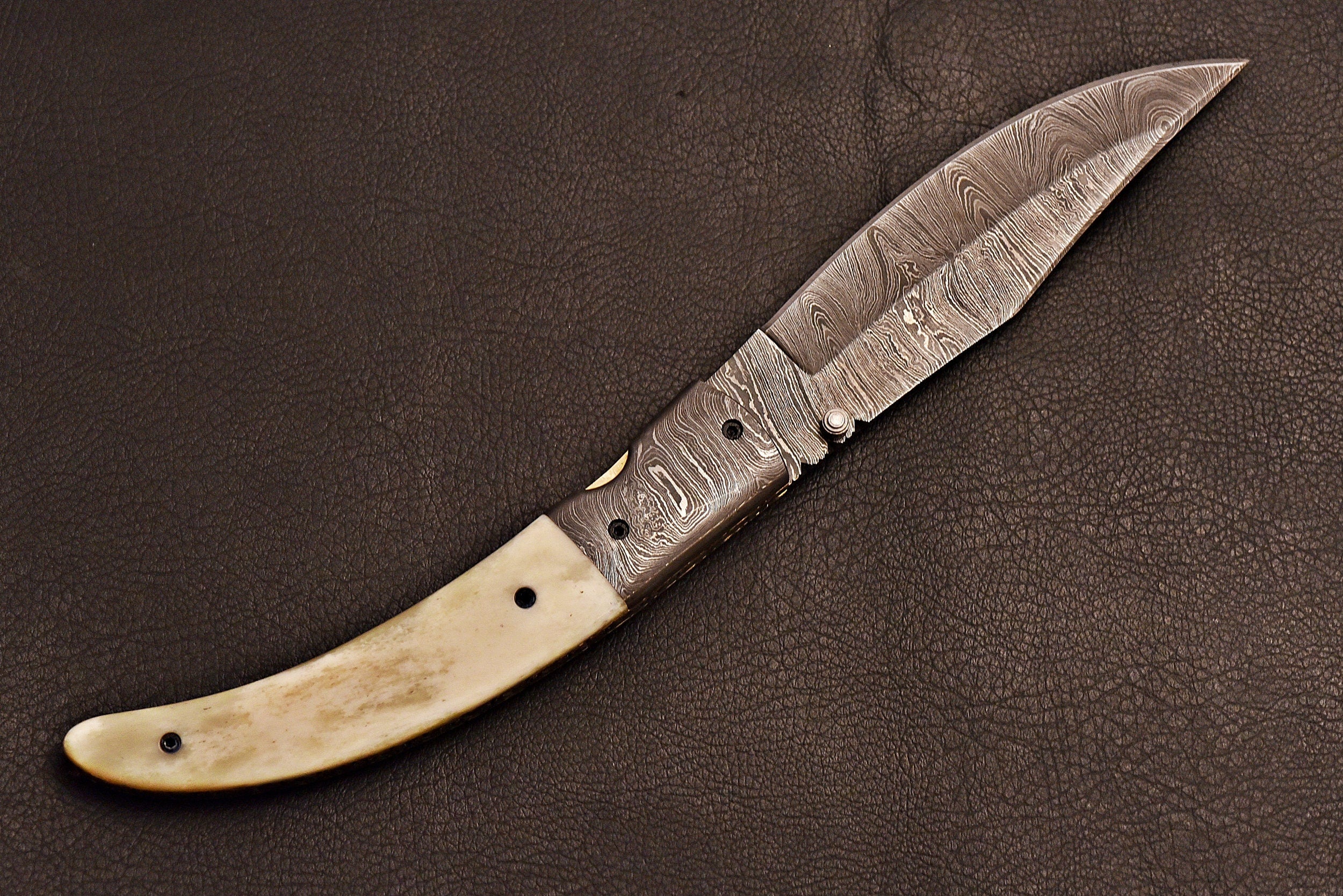 Handmade Damascus steel pocket knife with leather sheath