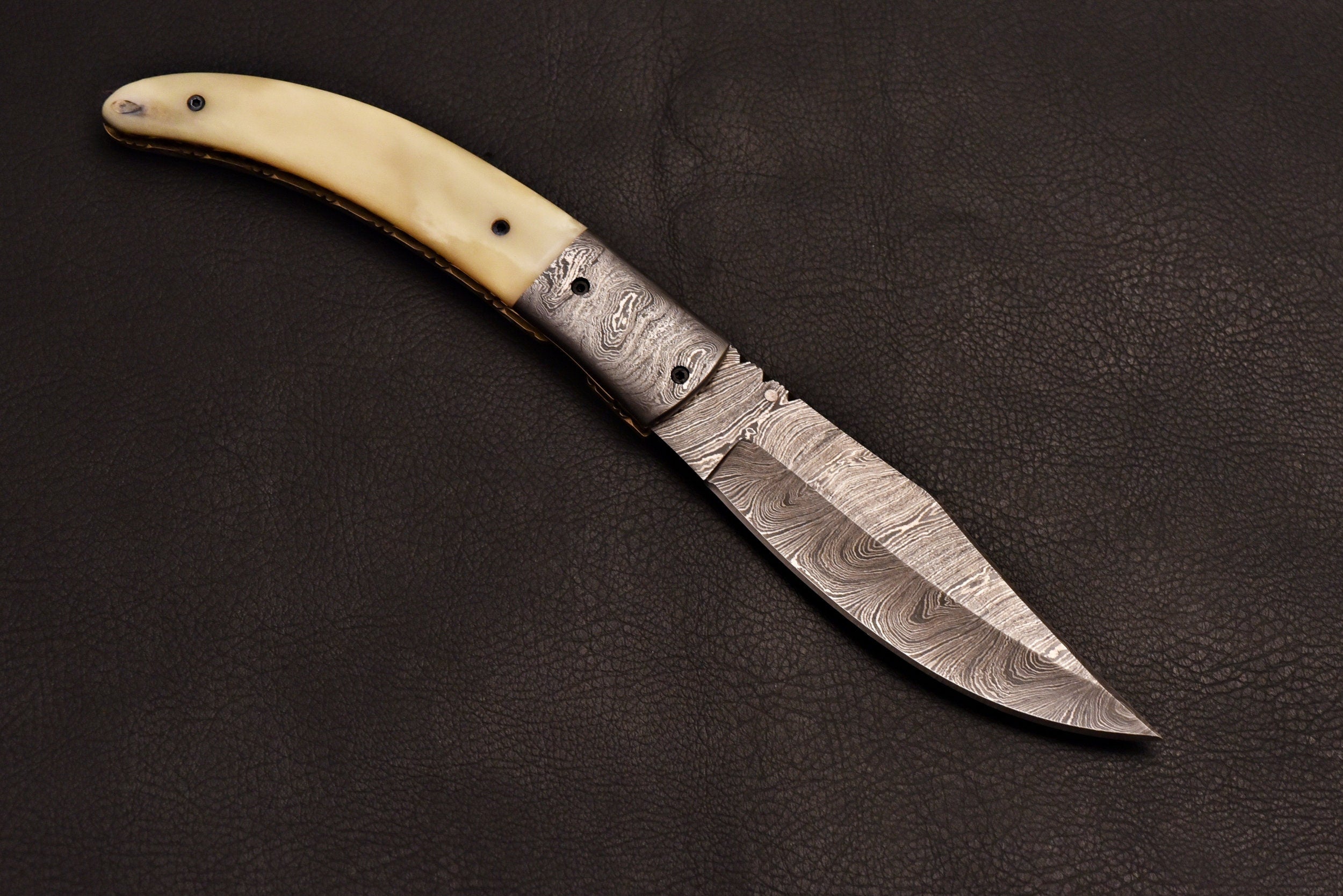 Handmade Damascus steel pocket knife with leather sheath